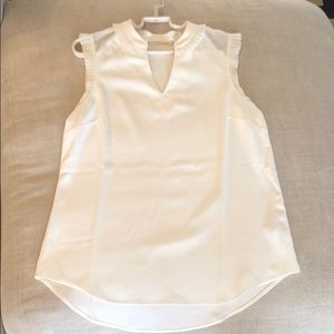 White sleeveless blouse